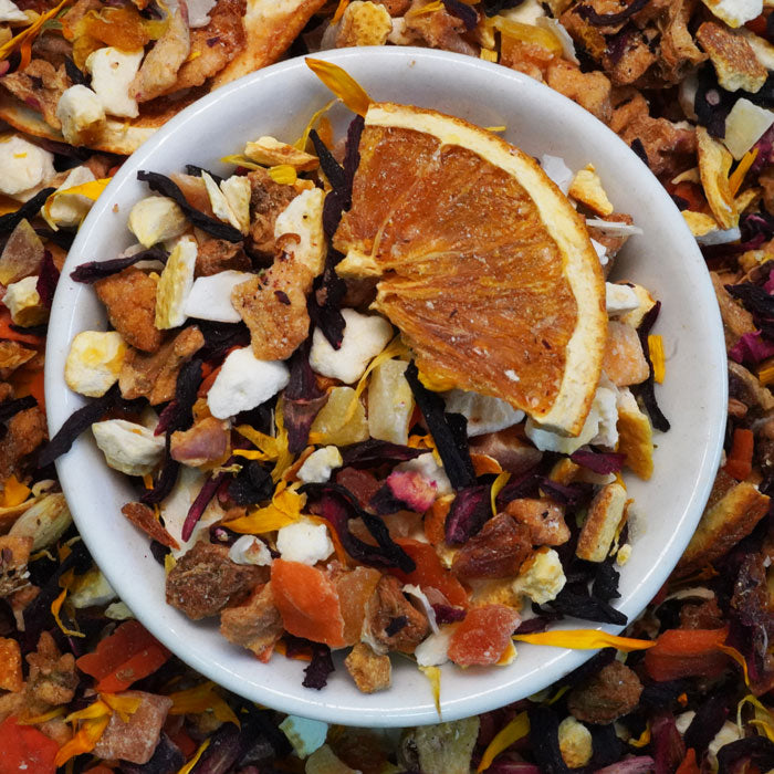 orange based fruit tea in a saucer